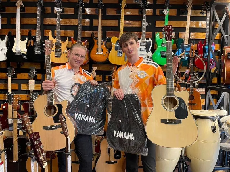 Two Volunteers with new guitars